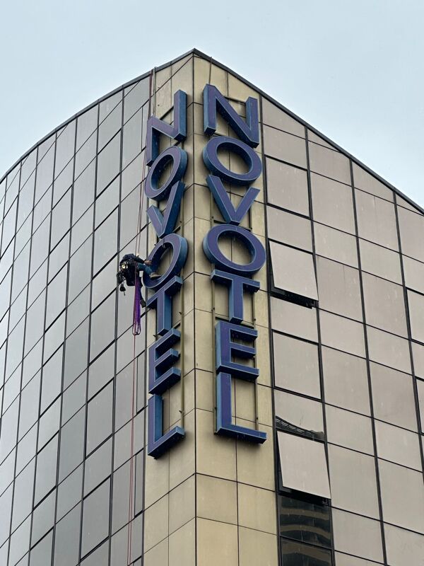 Technician using safety harness during work